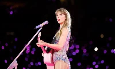 BREAKING NEWS: Taylor Swift dressed in a beautiful Stunning sparkling dress with her pink guitar sending fans into frenzy causing commotion as fans screamed Calling Her Barbie Tay